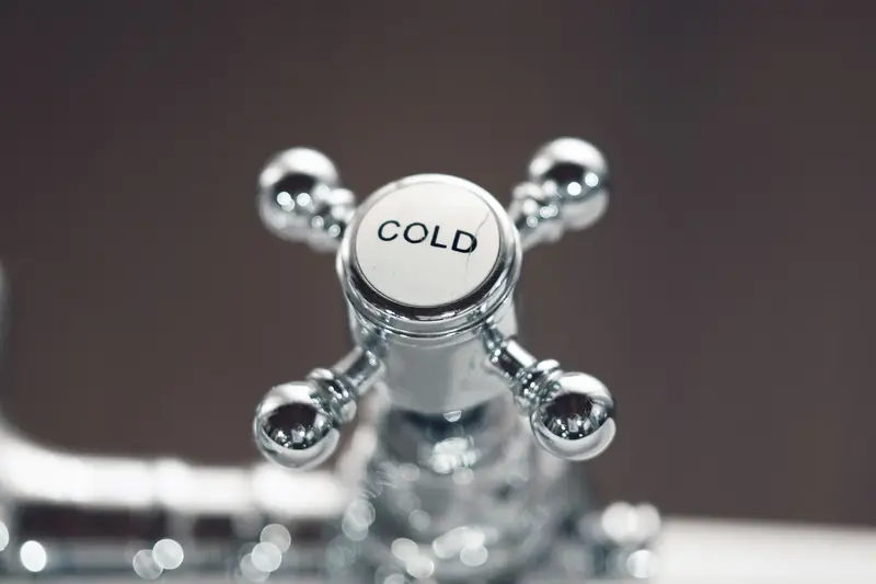Chrome bathroom tap with a cold water handle